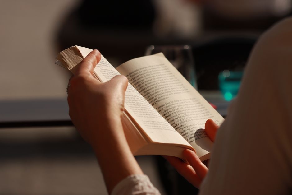 Detailed shot of an open book emphasizing printed text and paper texture.